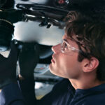 Volvo maintenance technician changing an oil filter