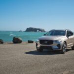 A pre-owned Volvo vehicle parked near the coast